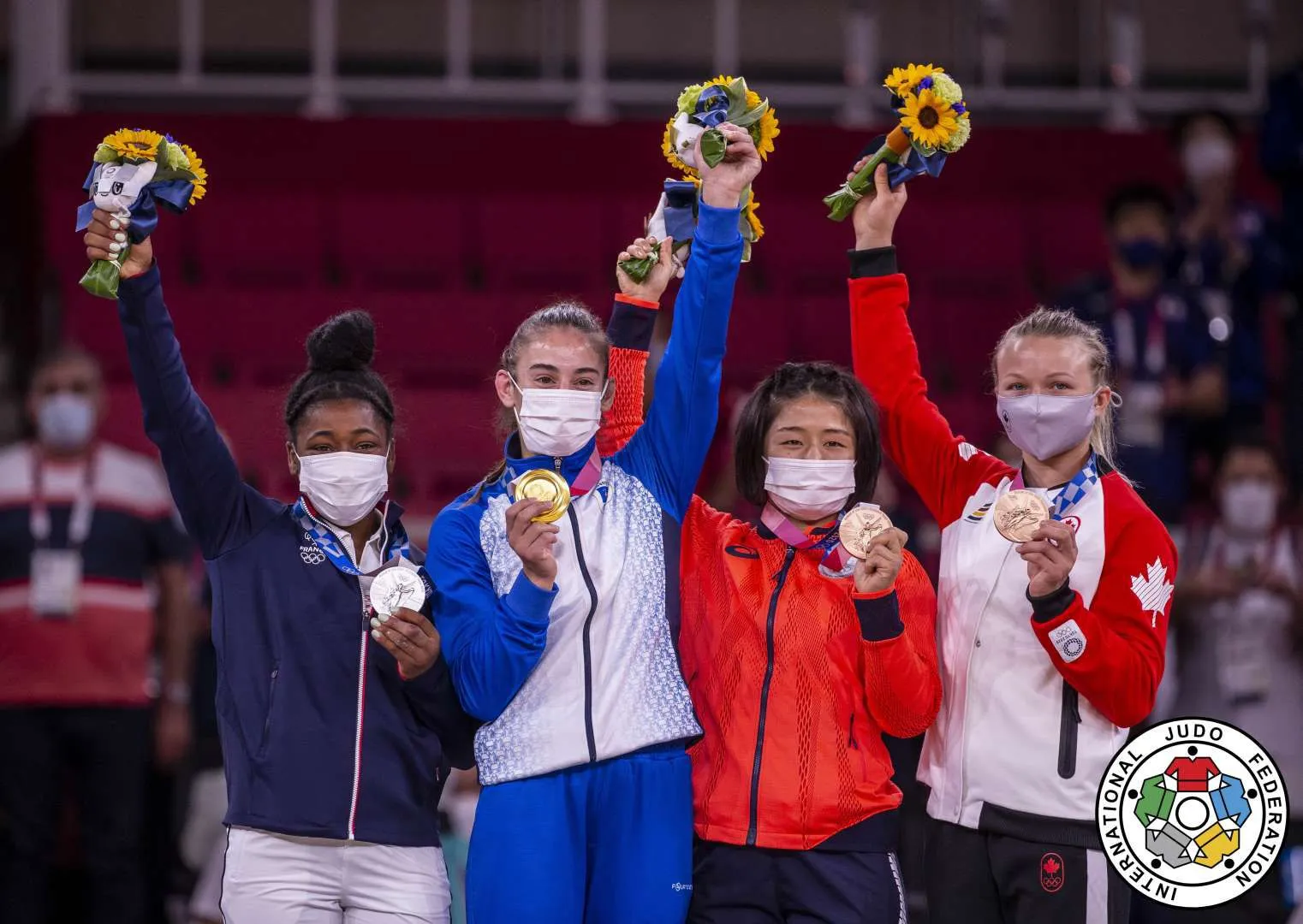 Nora with gold medal and flowers